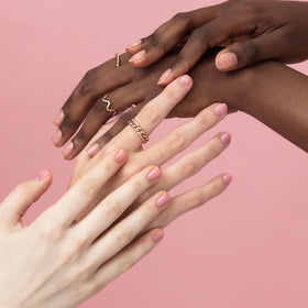 Probelle applied on hands in lifestyle scene showing strengthened, polished nails