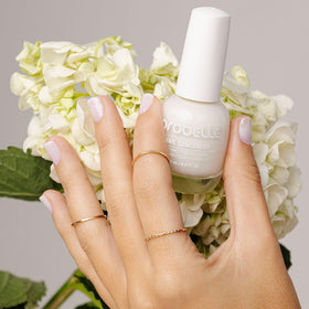 Probelle swatch on nail tip revealing sheer brightening finish benefit