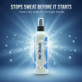 Professional Hair Labs spraying onto towel demonstrating quick-dry prep for adhesives