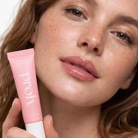 PROH SKIN model lips wearing glaze for plumper, hydrated look