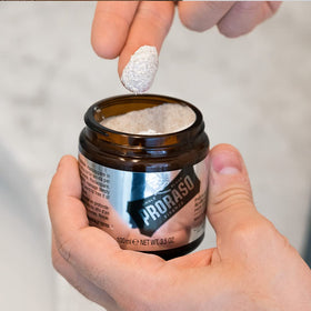 Proraso jar next to ruler showing 3.5oz size and travel-friendly benefit
