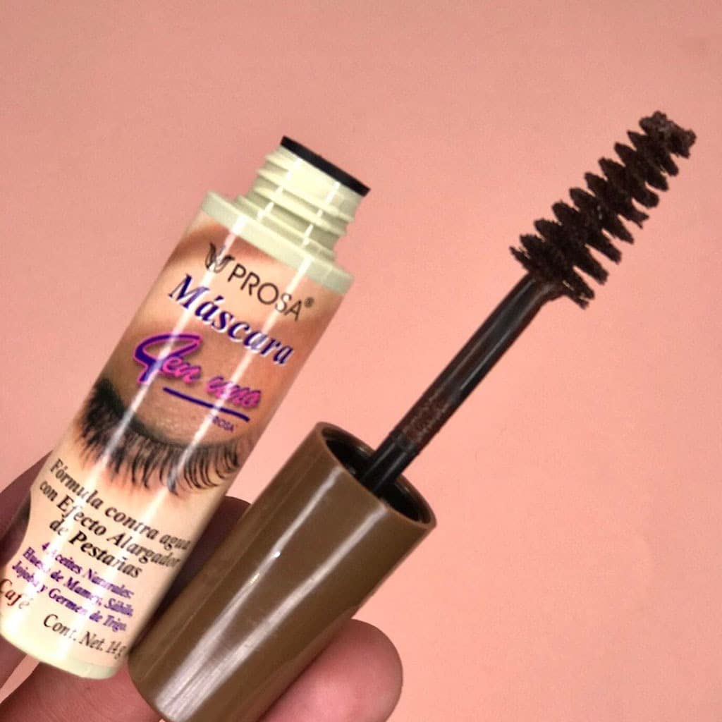 Prosa mascara beside a coin showing compact size and travel convenience