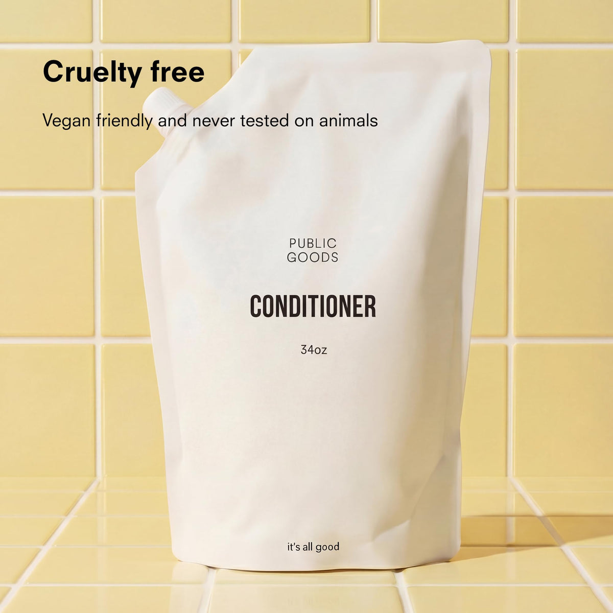 Public Goods creamy conditioner texture close-up showing moisturizing benefit