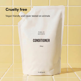Public Goods creamy conditioner texture close-up showing moisturizing benefit