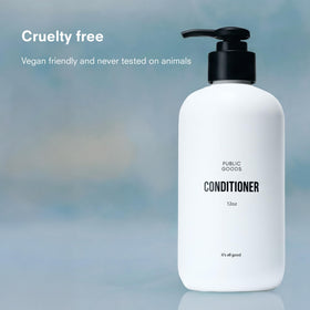 Creamy conditioner texture on palm from Public Goods showing rich moisture