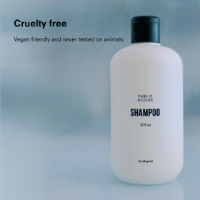 Public Goods shampoo texture close-up on palm showing light lather and nourishing oils