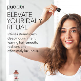 PURA D'OR brush applying oil to eyebrow for conditioning and fuller appearance