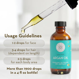 Pure Body Naturals argan oil on fingertips for facial hydration and quick absorption