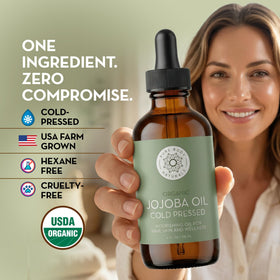 Pure Body Naturals bottle held in hand to show 4 fl oz size scale
