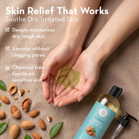 Pure Body Naturals oil pouring from spout highlighting silky texture