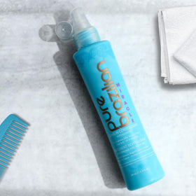 pure brazilian size comparison in hand illustrating 6.78 oz travel-friendly convenience