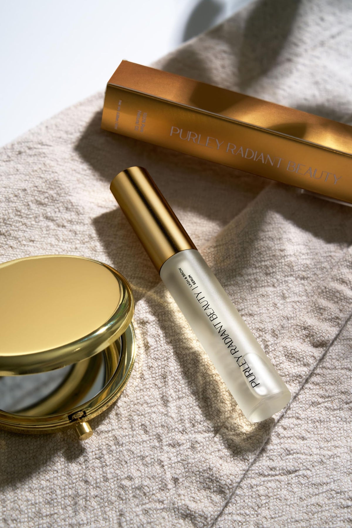 Purely Radiant ingredient flatlay with castor oil and rosemary illustrating natural formulation benefit