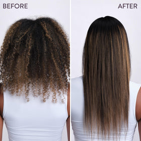 Hands applying Pureology mask to hair demonstrating detangling action