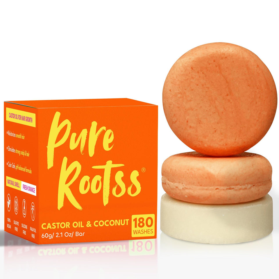 PureRootss front packaging showing castor oil shampoo and coconut conditioner benefits