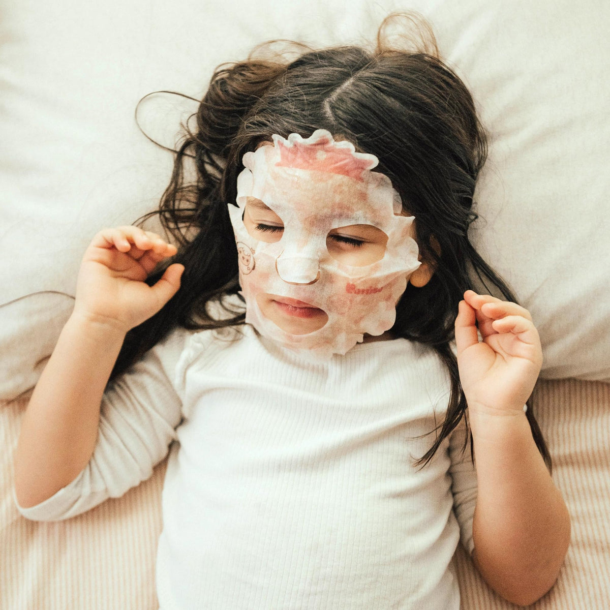 Puttisu mask fitted on a child's face showing true kid-size coverage