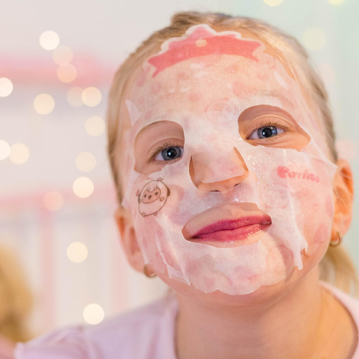 Child enjoying spa playtime with Puttisu mask promoting calming skincare fun