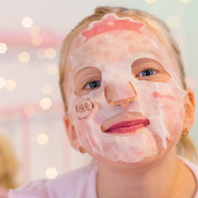 Child enjoying spa playtime with Puttisu mask promoting calming skincare fun
