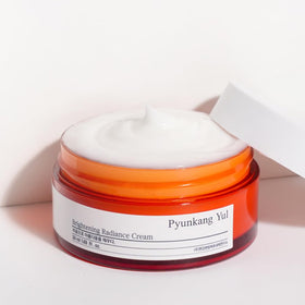 Pyunkang Yul size comparison with coin showing compact 50ml travel-friendly size