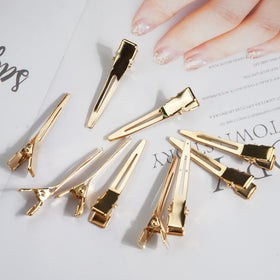 Qearl clips securing a pin curl demonstrating styling hold benefit