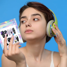 Qenk bags storing false lashes, jewelry, and nail charms to show versatile use