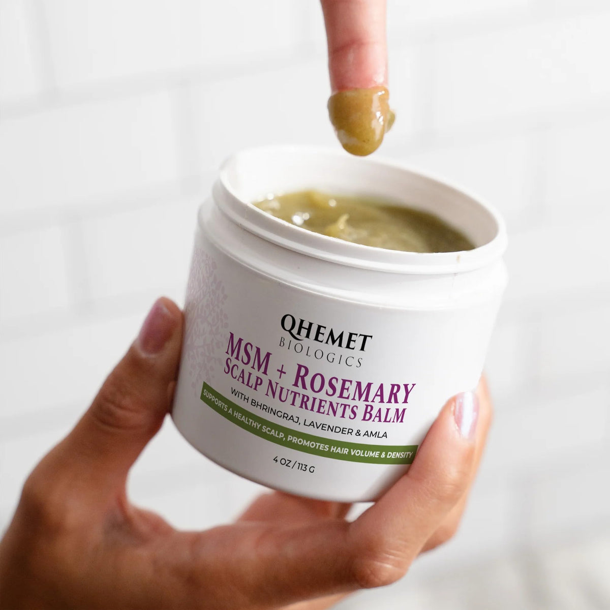 Qhemet Biologics open jar showing balm texture for deep nourishment
