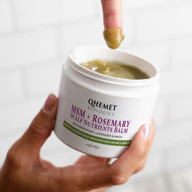 Qhemet Biologics open jar showing balm texture for deep nourishment