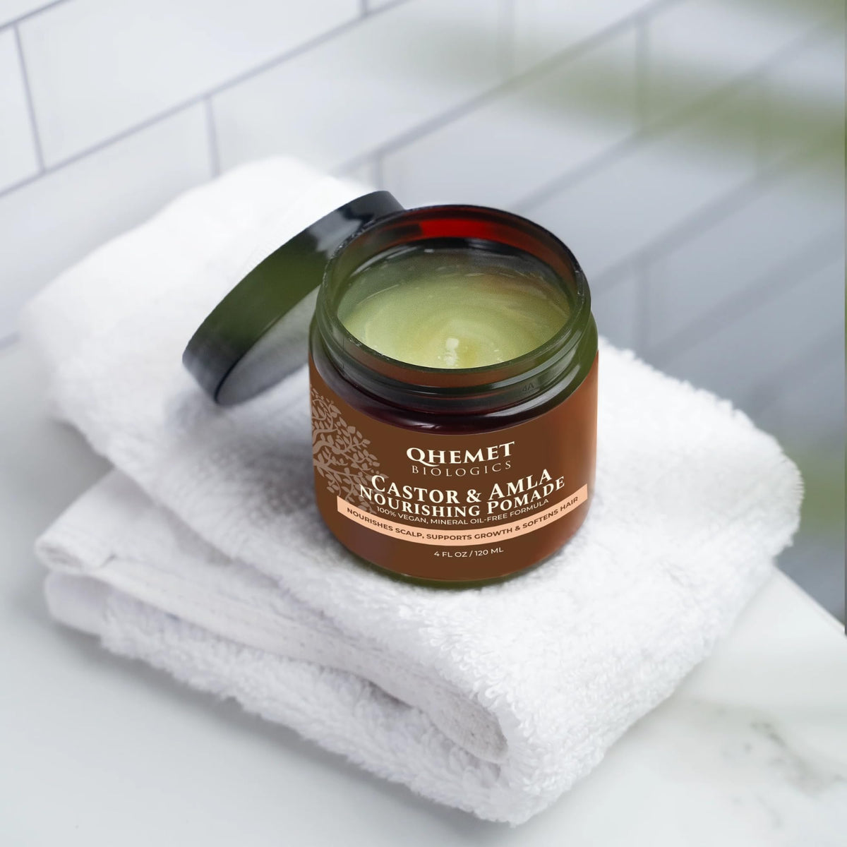 Qhemet Biologics open jar texture close-up showing creamy pomade for easy application
