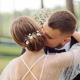QIUTIMIY side comb placed in a wedding updo adding floral elegance and hold