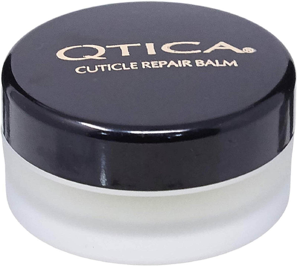 QTICA cuticle balm front tin showing label and portable size for on-the-go care