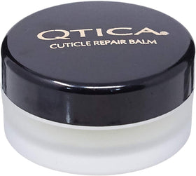 QTICA cuticle balm front tin showing label and portable size for on-the-go care