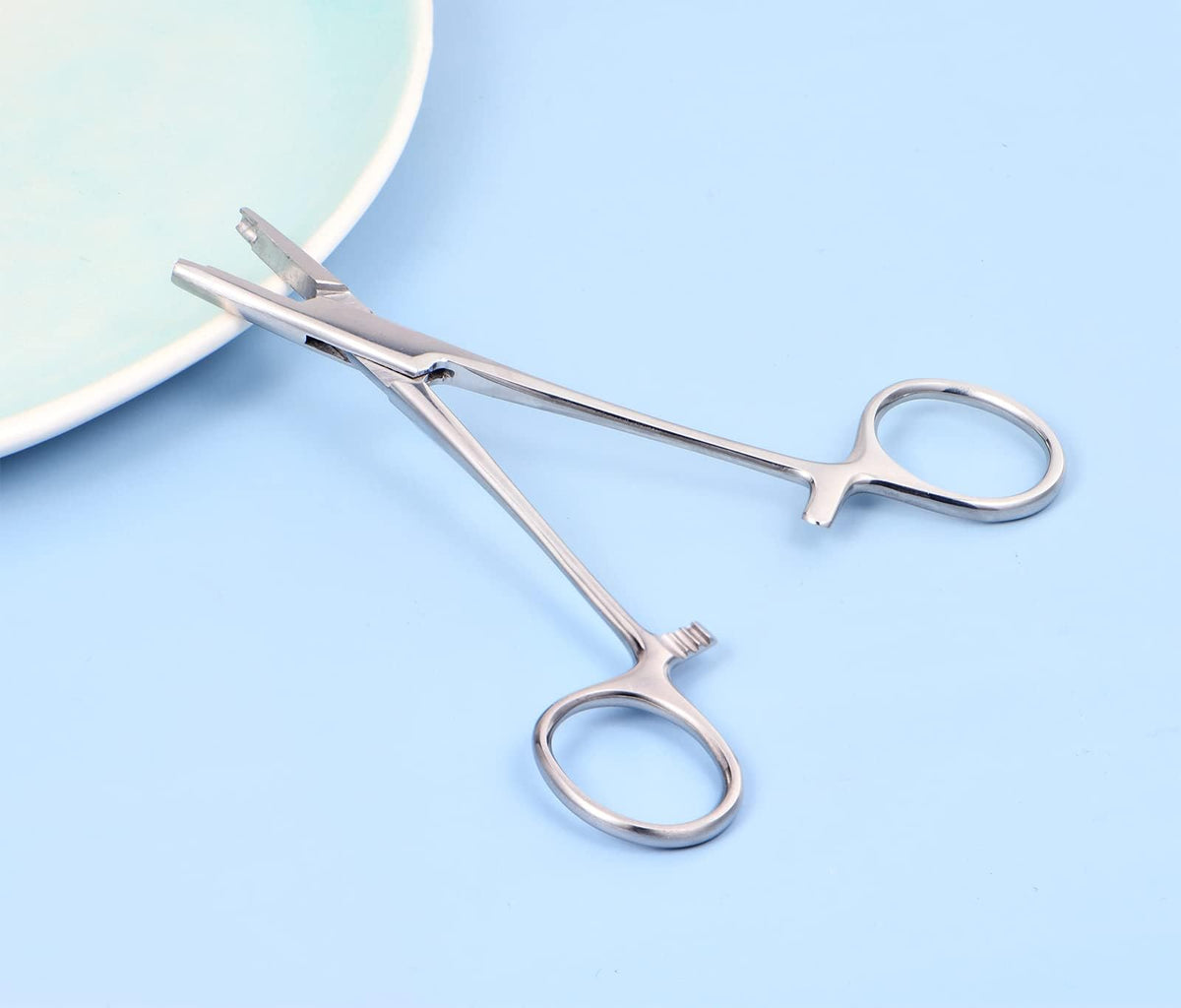 QWALIT stainless steel finish displayed in studio setting for easy sterilization