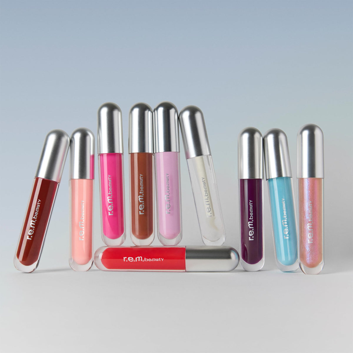 r.e.m. beauty swatch on hand showing cotton candy tint and buildable shine