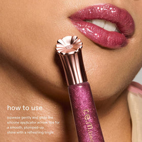 r.e.m. beauty Plum Petals swatch showing reflective shine and color payoff benefit