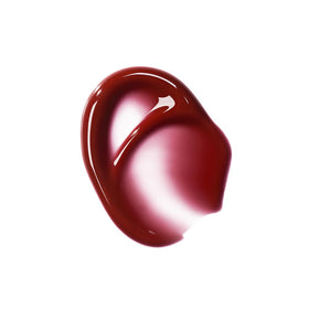 r.e.m. beauty Plum Petals applicator wand depositing glossy product for easy application