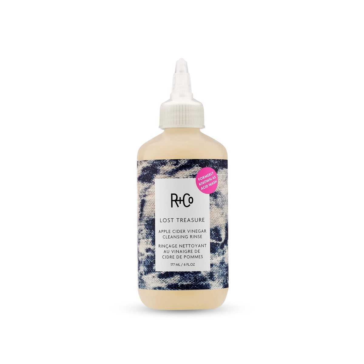 R+Co bottle front view showing product and benefits