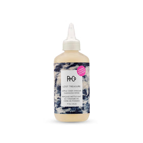 R+Co bottle front view showing product and benefits