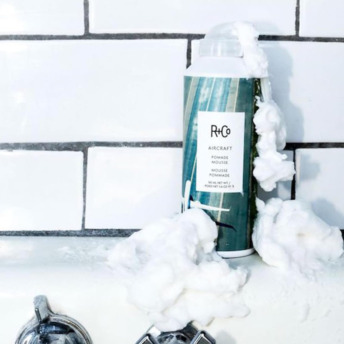 R+Co Aircraft applied to damp hair for even distribution and volume