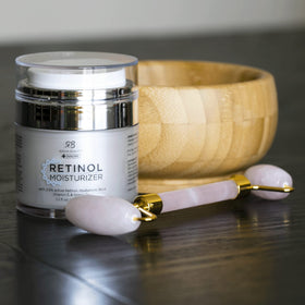 Radha Beauty on bathroom vanity styled with plants showing daily routine and elegant packaging