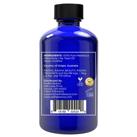 Radha Beauty tea tree dropper dispensing a precise drop for controlled DIY blends