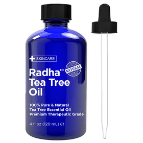 Radha Beauty tea tree 4 oz cobalt bottle showing label and capacity for long-lasting use