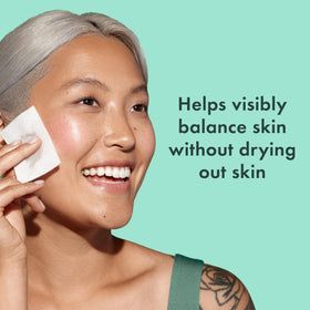 Rael pouring clear toner into cotton pad demonstrating lightweight texture and absorbency