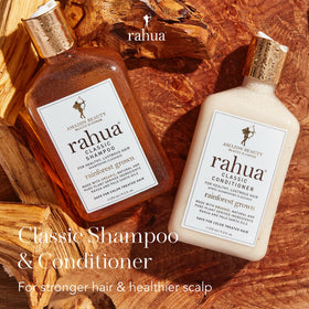 Rahua conditioner being poured into hand demonstrating easy spreadability and softness benefit