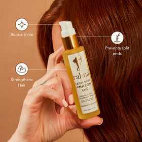 Rahua hair oil being applied to damp hair for frizz control and shine