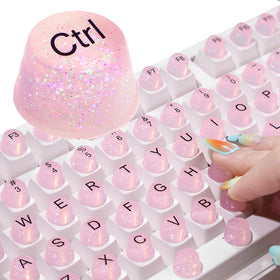 Raised Button front packaging showing pink glitter keycaps and quantity benefit