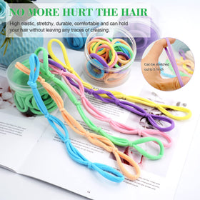 Random Mood hair tie on hand for scale, shows stretch and size reliability benefit