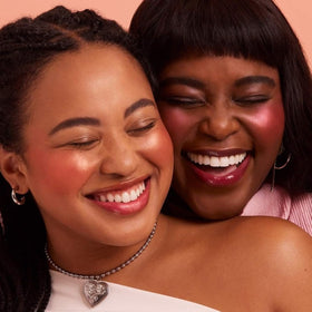 Rare Beauty compact next to coin demonstrating travel-friendly size