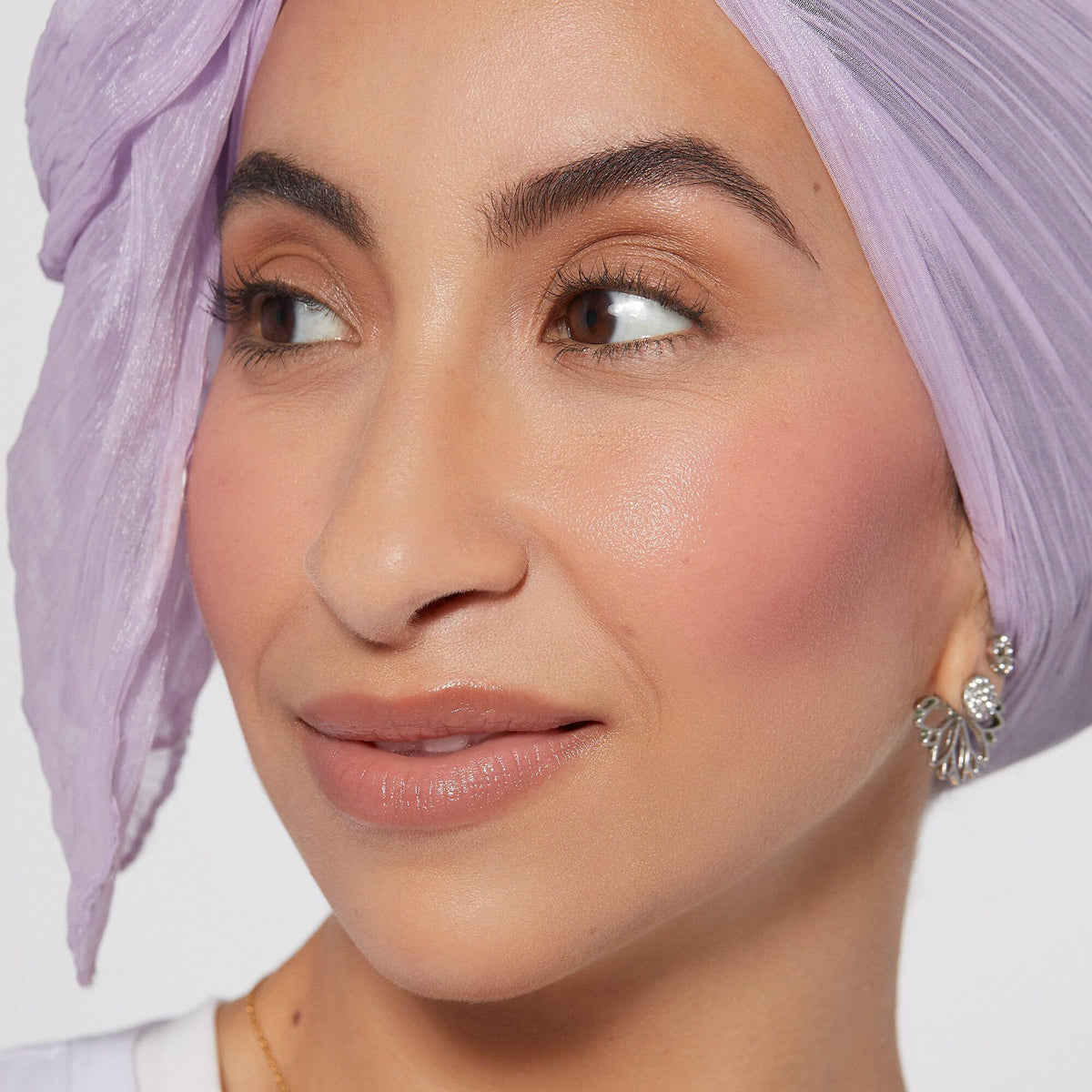 Rare Beauty texture close-up of liquid drop demonstrating smooth, blendable consistency