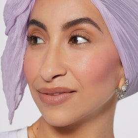 Rare Beauty texture close-up of liquid drop demonstrating smooth, blendable consistency