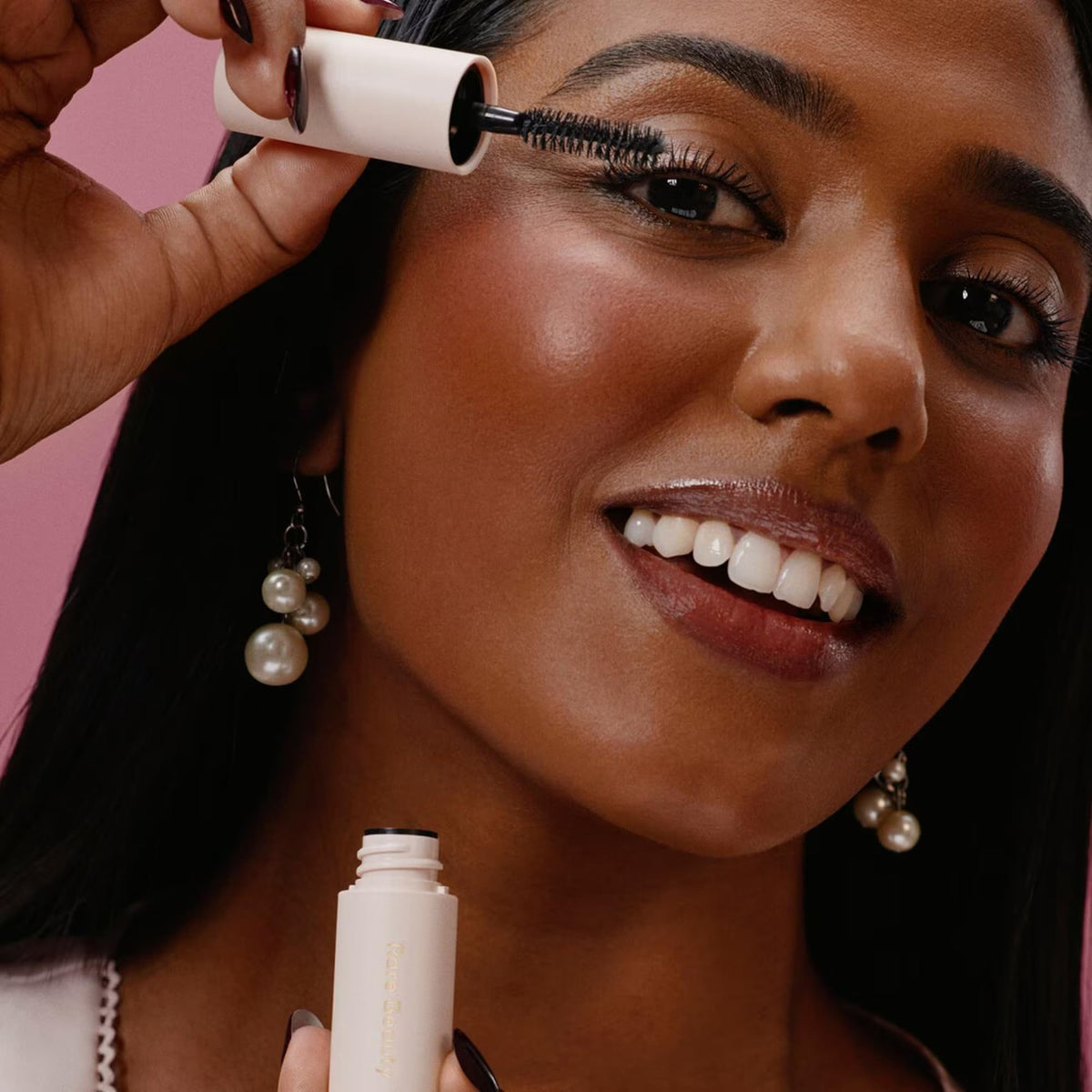 Rare Beauty clear brow gel texture swirl illustrating smooth, flexible hold and finish