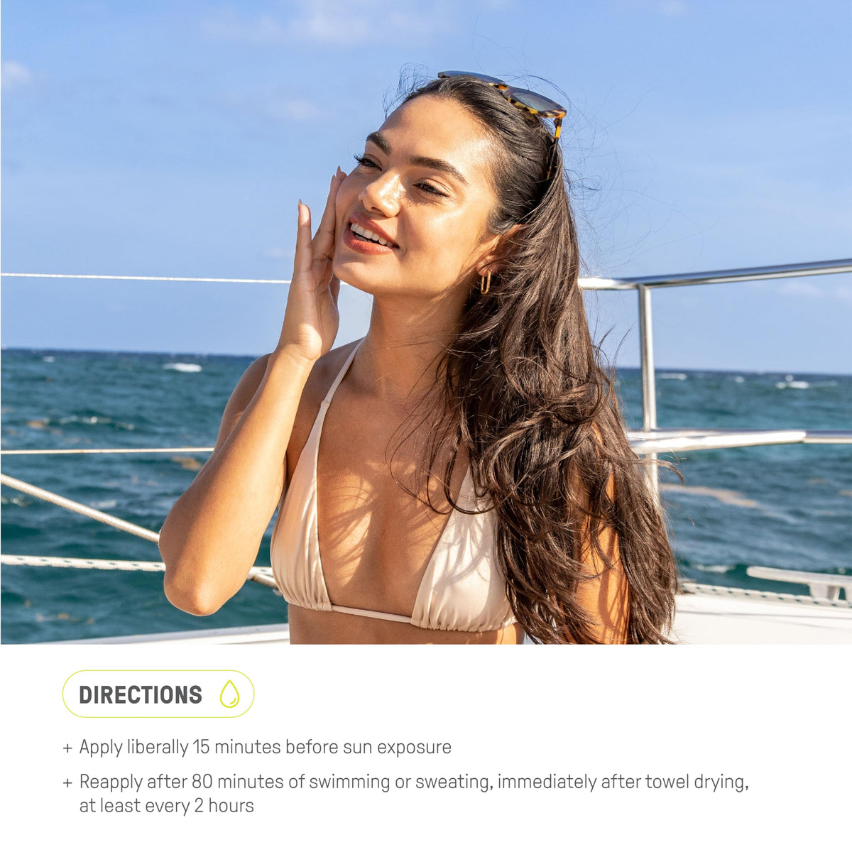 Raw Elements tin on beach towel conveying reef-safe, outdoor use